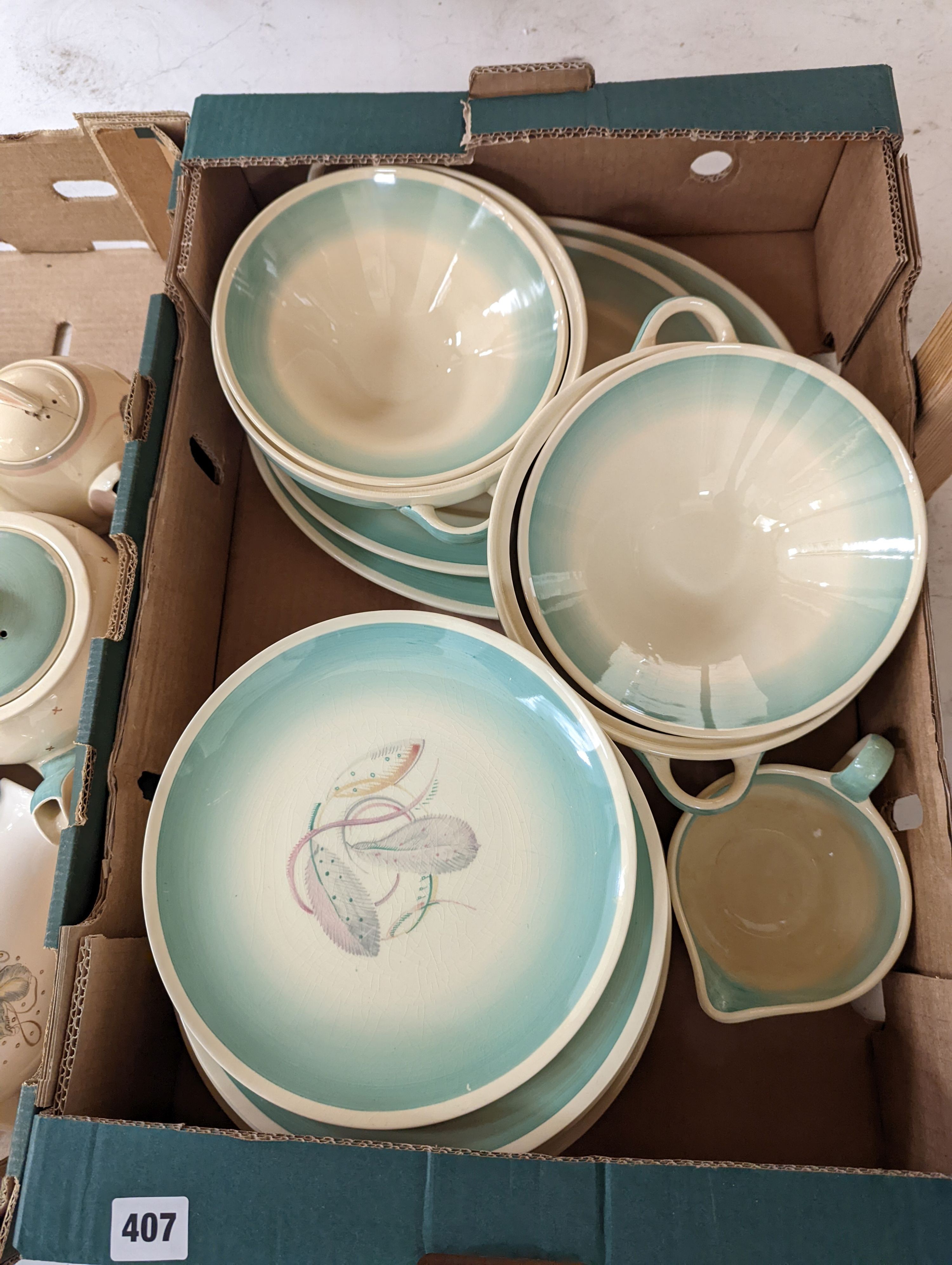 Two Susie Cooper part dinner services and various Susie Cooper teapots